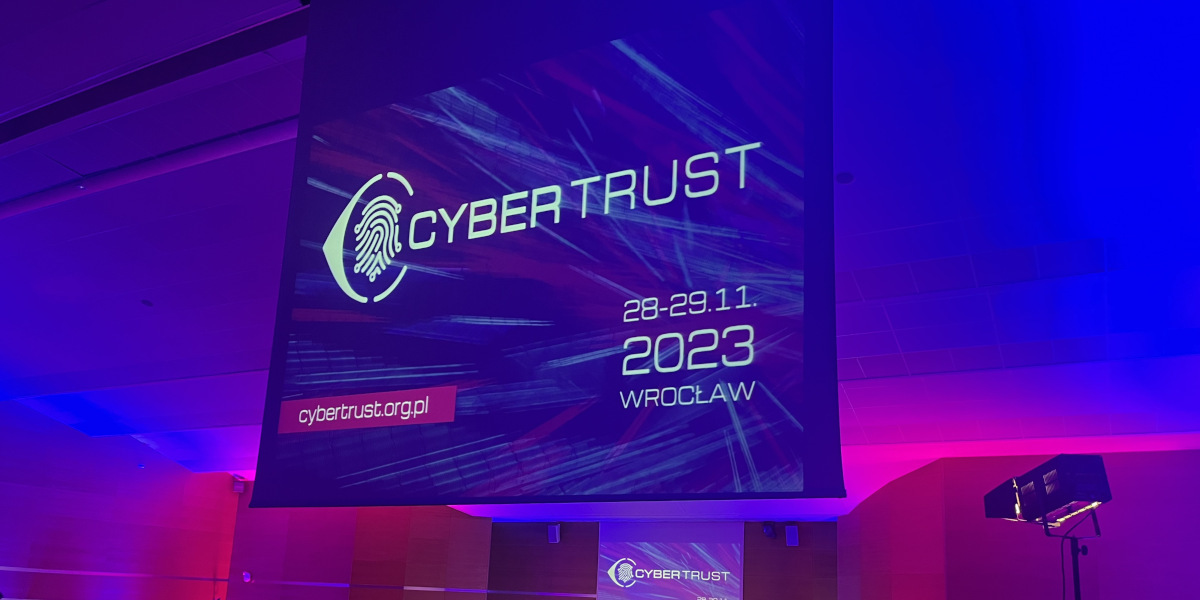 Slajd z napisem CyberTrust 2023, data i miejsce wydarzenia.