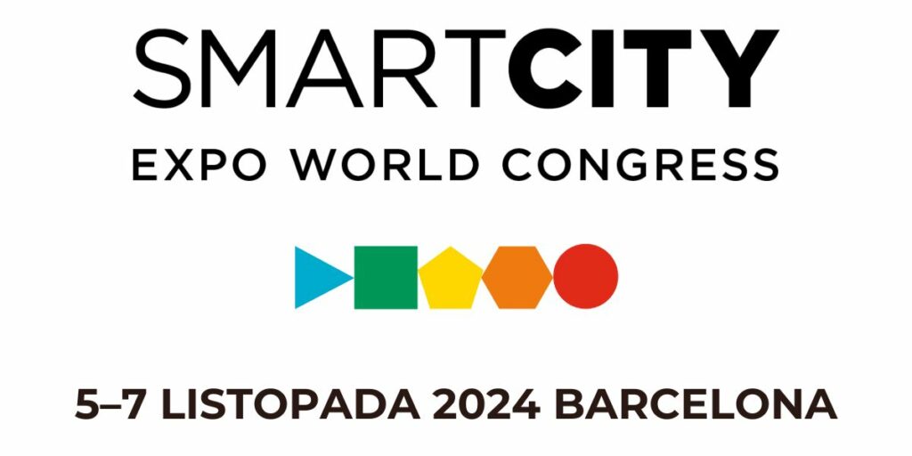 Na górze na białym tel napis: SMART CITY EXPO WORD CONGRESS, Po środku w jednym rzędzie figury geometryczne: niebieski trójkąt, zielony kwadrat, żółty pięciokąt, pomarańczowy sześciokąt, czerwone koło. Poniżej, na dole, napis: 5–7 LISTOPADA 2024 BARCELONA.